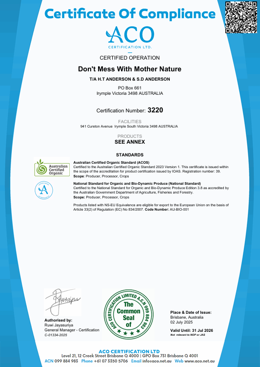 Australian Certified Organic certification badge displayed on wooden farm stand with fresh organic grapes